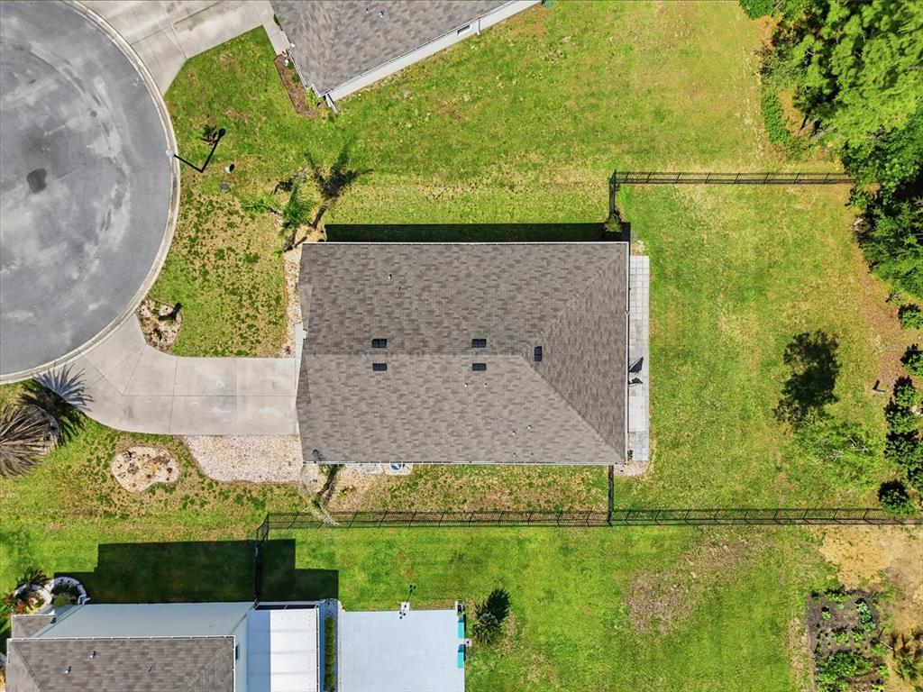 660 Hickory Course Loop Ocala, FL 34472 - Photo 42 of 45 an aerial view of a house with a yard