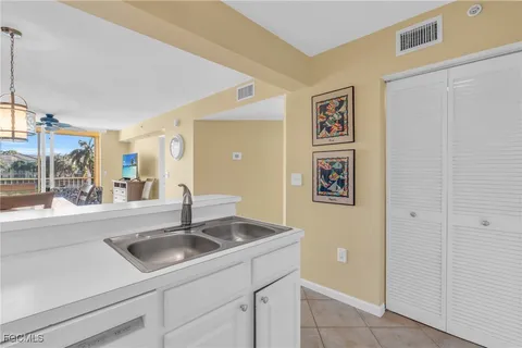 a kitchen with a sink and a window