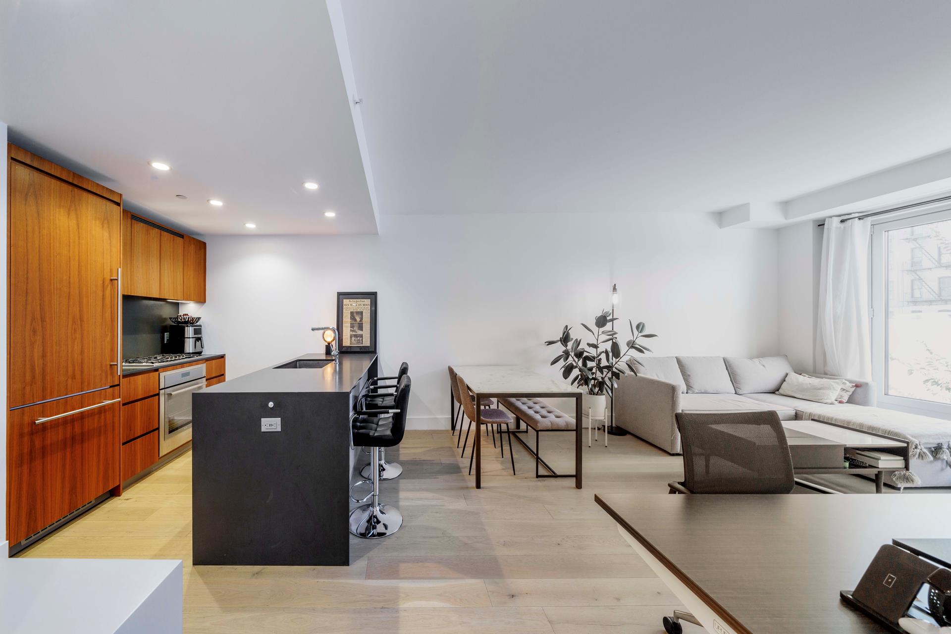 575 4th Avenue, Unit 2G Brooklyn, NY 11215 - Photo 2 of 7 a living room with furniture and a flat screen tv