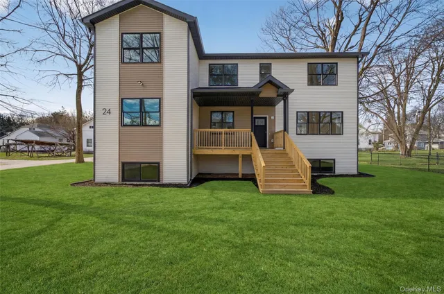 a front view of a house with a yard
