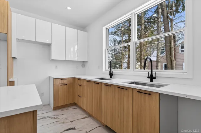 a kitchen with a sink and cabinets
