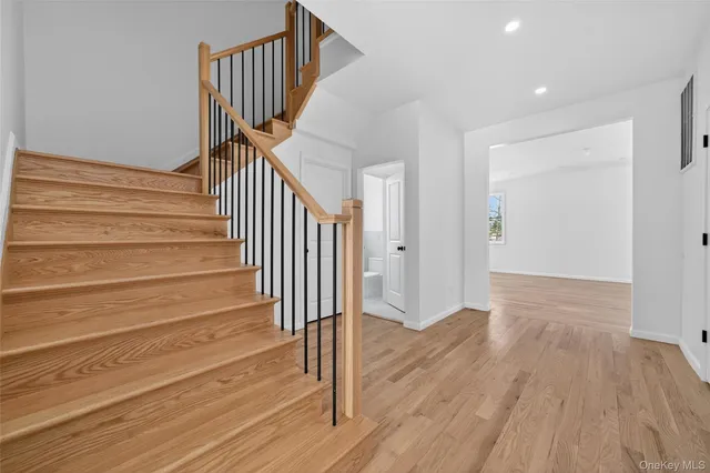 a view of entryway with wooden floor