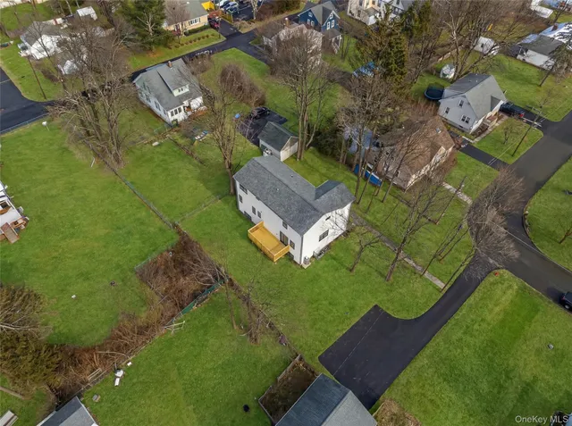an aerial view of a house with a garden
