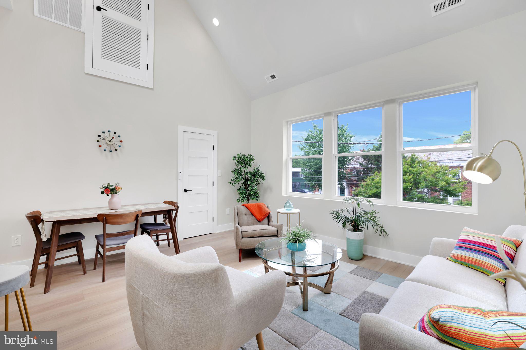 4019 9th Street Northeast, Unit 4 Washington, DC 20017 - Photo 9 of 32 a living room with furniture and a large window