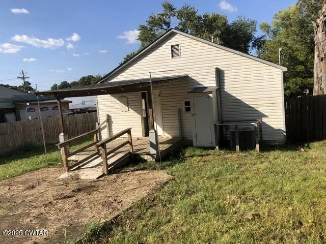 a house view with a backyard space