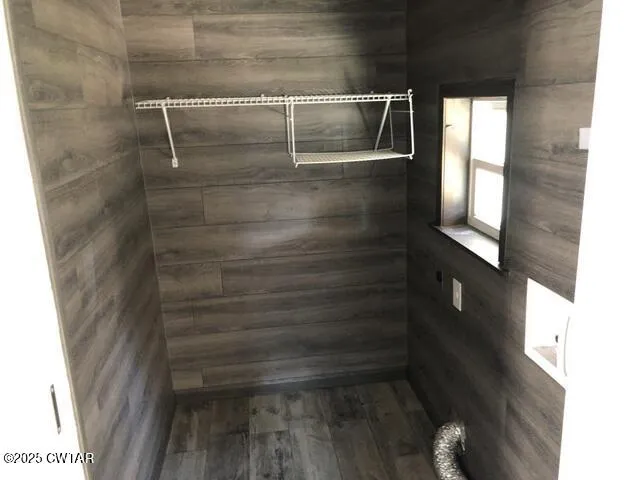 a kitchen with a sink a window and cabinets