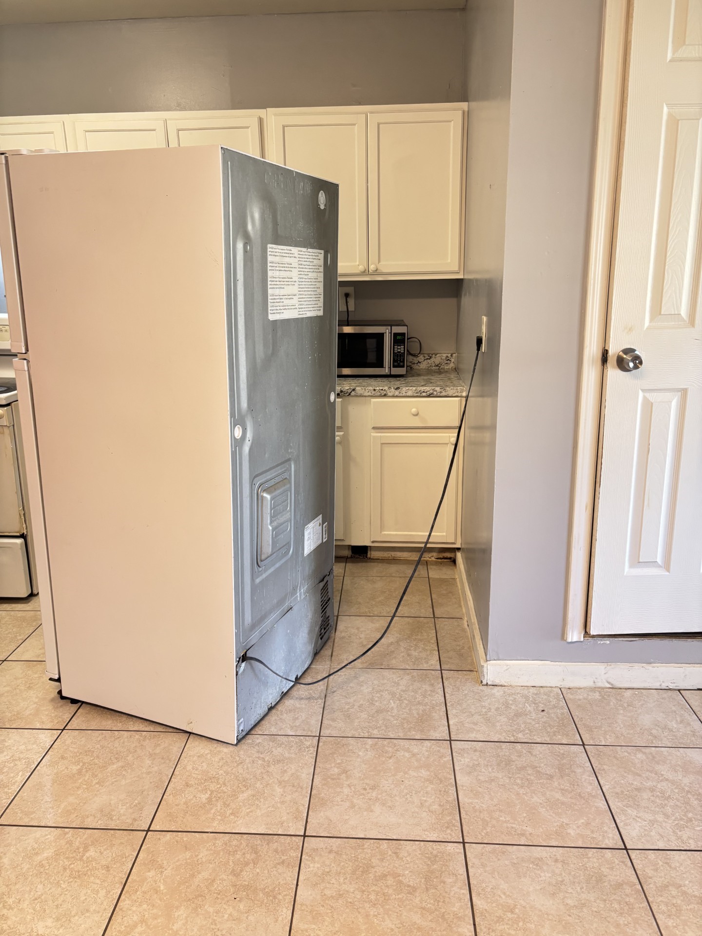538 Glenvale Drive, Unit B Houston, TX 77060 - Photo 9 of 16 a white refrigerator freezer and a stove sitting inside of a kitchen