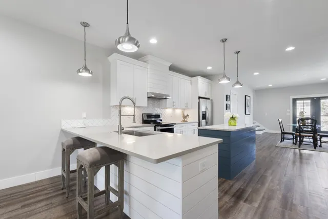 a kitchen with a table and chairs in it