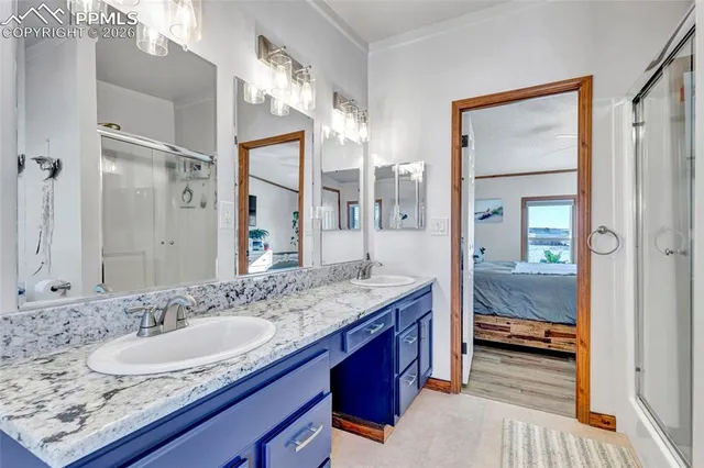 a view of a hallway with wooden floor and entryway
