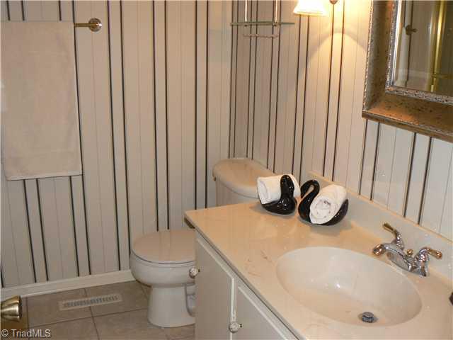 2444 Scott Mountain Road Asheboro, NC 27205 - Photo 11 of 16 Other. This is the full hall bath. Bathtub with overhead shower to left. All three baths have tiled floors.