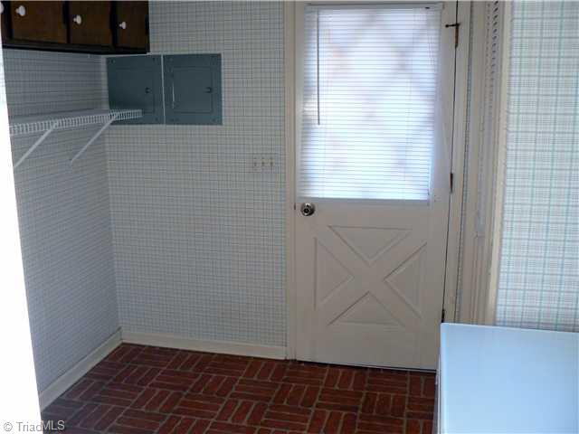 2444 Scott Mountain Road Asheboro, NC 27205 - Photo 14 of 16 Laundry Room. The Laundry is 8 8" X 9 7" and has overhead cabinets, hanging area and a closet. The door opens to the outside beside the screened porch.