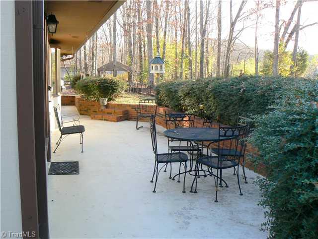 2444 Scott Mountain Road Asheboro, NC 27205 - Photo 15 of 16 Patio/Deck. There is nearly 400sf of patio on the back. This picture is taken from the section off the Master Bedroom. Nice area for summer entertaining or just a nice private place to enjoy the evening.