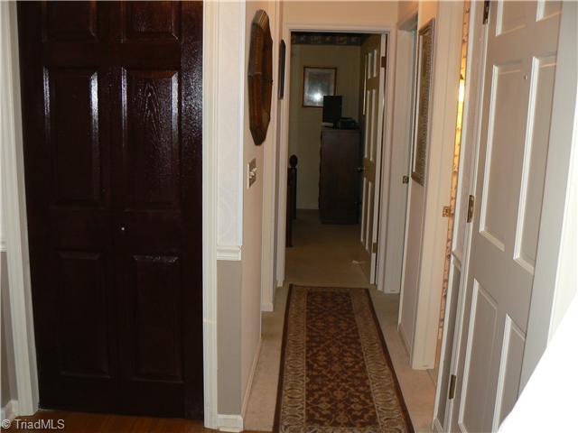 2444 Scott Mountain Road Asheboro, NC 27205 - Photo 9 of 16 Other. The front door is on the right. This picture is taken from the Living Room. To the right of front door is the hall leading to the other bedrooms, a full bath & a half bath. The dark door is one of seven closets in the house.