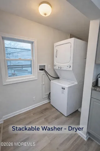 a view of a hallway with washer and dryer