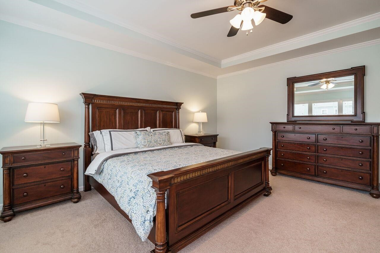 5602 Wade Park Boulevard Raleigh, NC 27607 - Photo 27 of 34 Tray ceiling, custom designed walk in closet and walk out deck/balcony with en suite spa-like bath. Owner's Suite