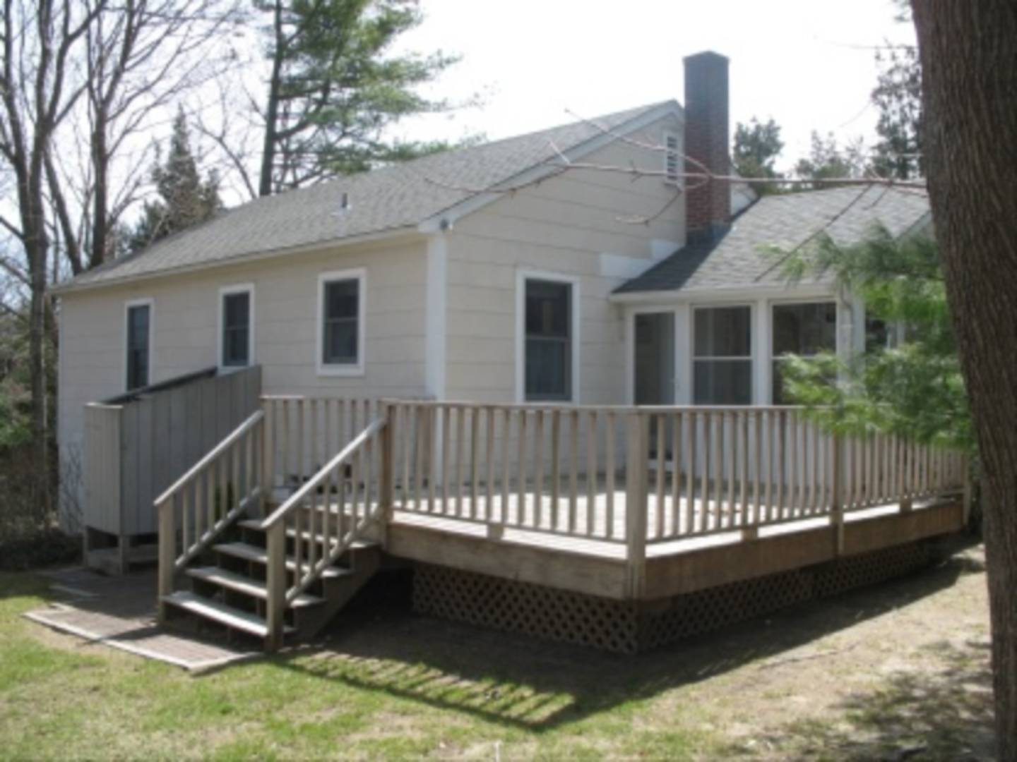 7 Cornell Road Sag Harbor, NY 11963 - Photo 8 of 8 a view of a house with a wooden deck