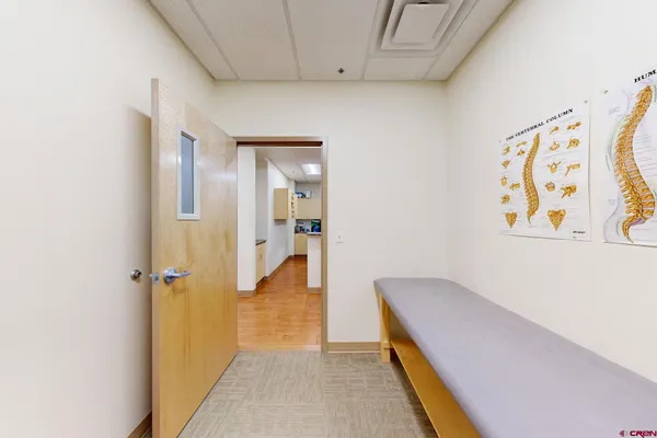 a hallway with sliding door and couch