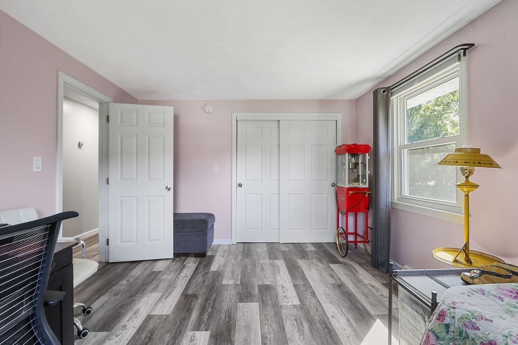 8 Given Drive Burlington, MA 01803 - Photo 18 of 42 a view of a livingroom with wooden floor and a window