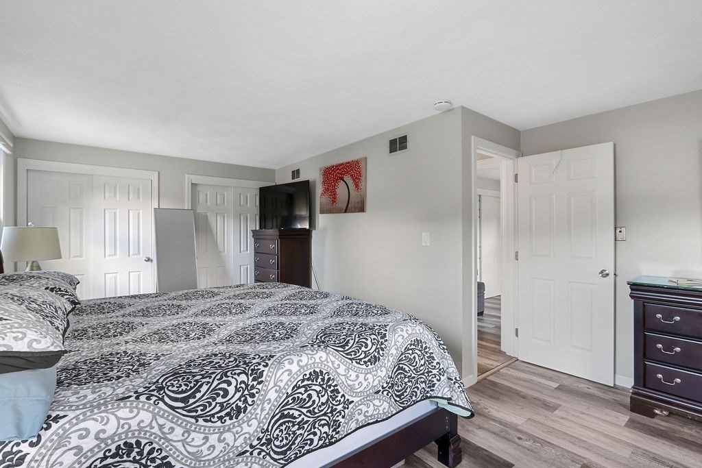 8 Given Drive Burlington, MA 01803 - Photo 20 of 42 a bedroom with a bed and a closet