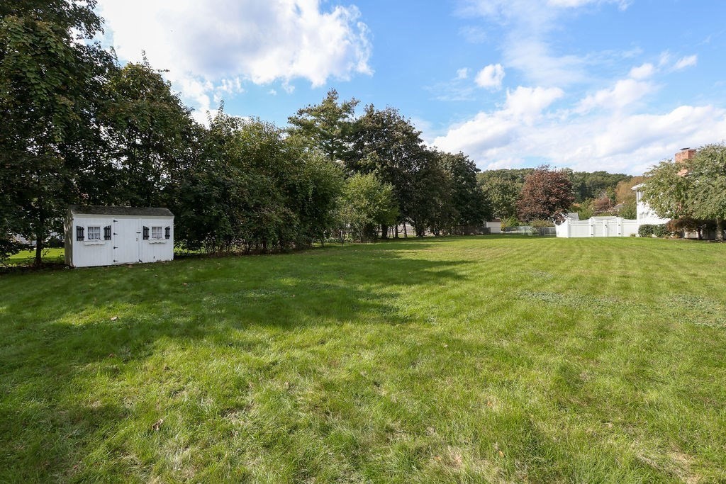8 Given Drive Burlington, MA 01803 - Photo 30 of 42 a view of a big yard with large trees