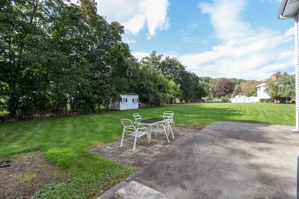 8 Given Drive Burlington, MA 01803 - Photo 38 of 42 a view of a chair and table in the garden
