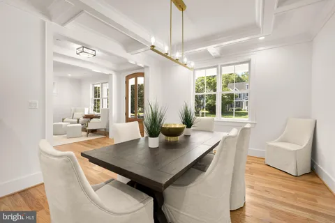 a kitchen with granite countertop stainless steel appliances a sink stove and cabinets