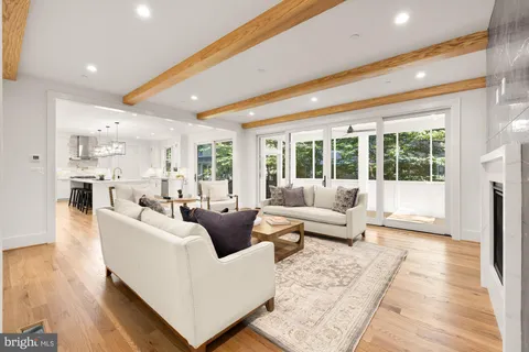 a spacious bathroom with a tub double sink and mirror