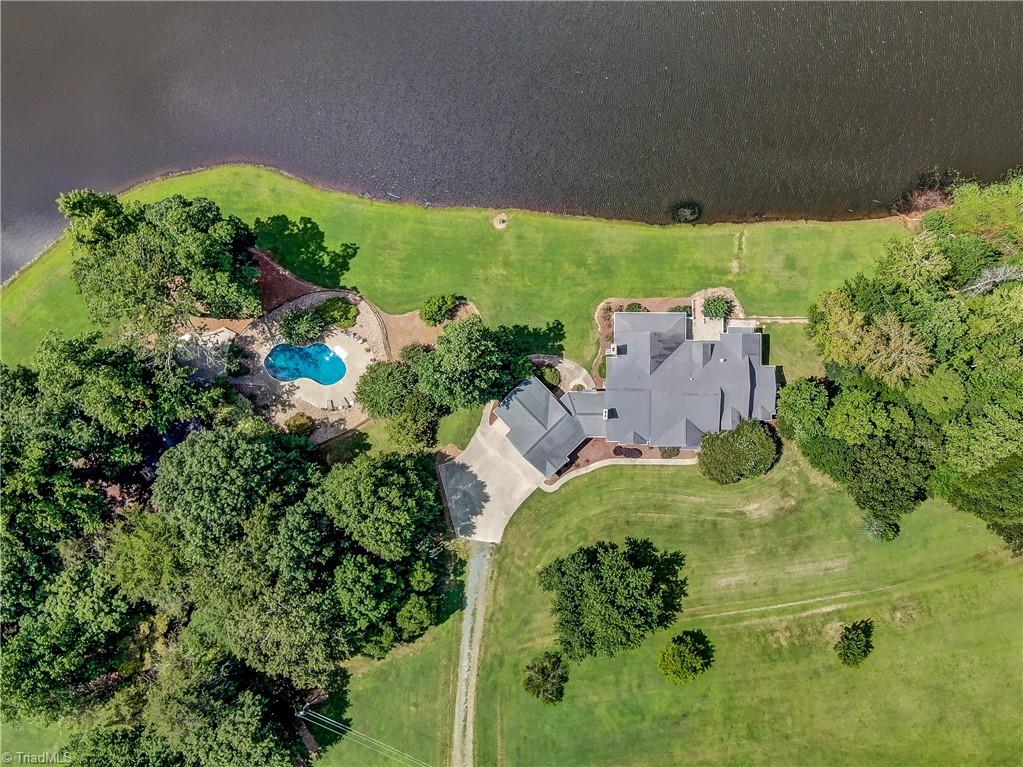 Custom build home with 18+ acres on an apprximately 7-8 acre lake.
