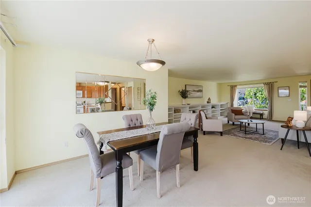 a view of a dining room with furniture and a livingroom