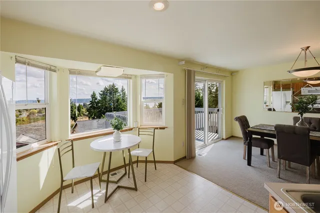 a dining room with furniture and window