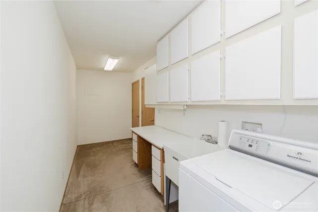 a view of storage and utility room with washer and dryer