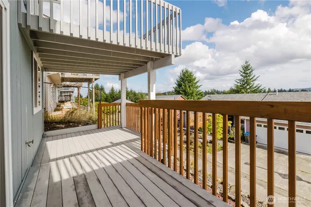 a view of balcony with wooden floor