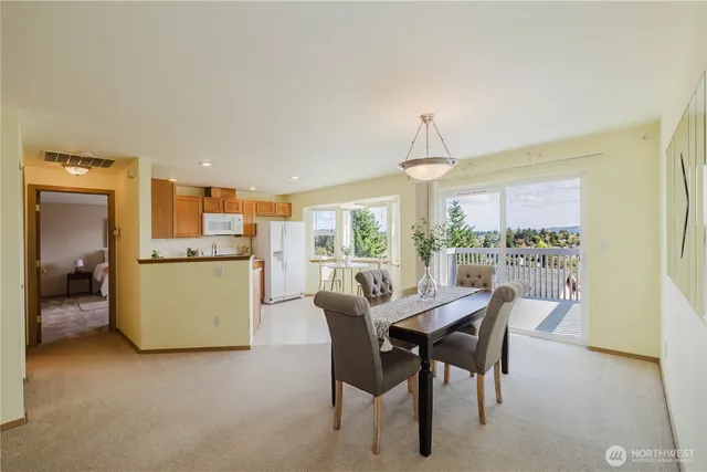 a view of a dining room with furniture window and outside view
