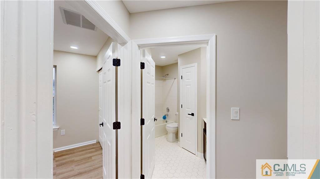 2405 Timber Ridge Court, Unit 2405 Sayreville, NJ 08859 - Photo 19 of 29 a bathroom with a shower and a glass door