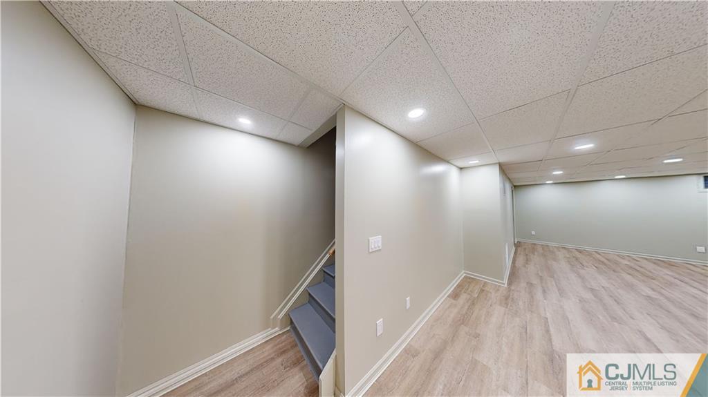 2405 Timber Ridge Court, Unit 2405 Sayreville, NJ 08859 - Photo 25 of 29 a view of hallway with a large window