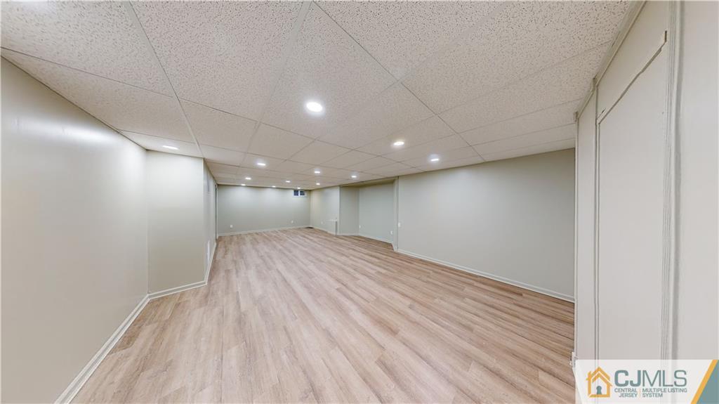 2405 Timber Ridge Court, Unit 2405 Sayreville, NJ 08859 - Photo 26 of 29 a view of hallway with wooden floor