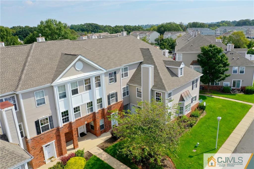 2405 Timber Ridge Court, Unit 2405 Sayreville, NJ 08859 - Photo 29 of 29 a aerial view of a house with a yard