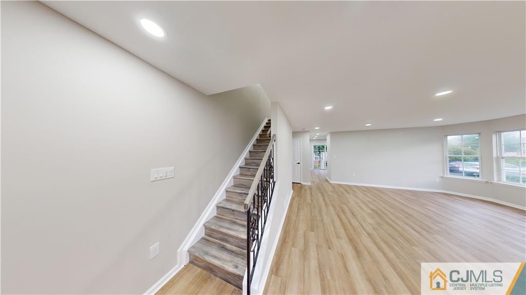 2405 Timber Ridge Court, Unit 2405 Sayreville, NJ 08859 - Photo 3 of 29 a view of an empty room with wooden floor