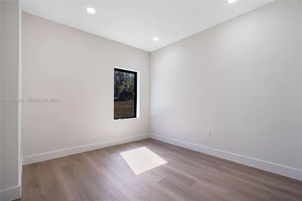 a bathroom with a sink toilet and mirror