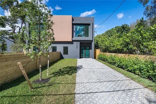 a front view of a house with garden