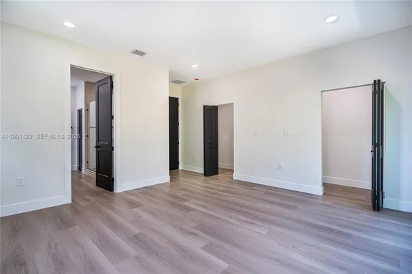 a bathroom with a double vanity sink and mirror
