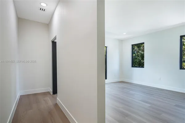 a bathroom with a double vanity sink toilet and mirror