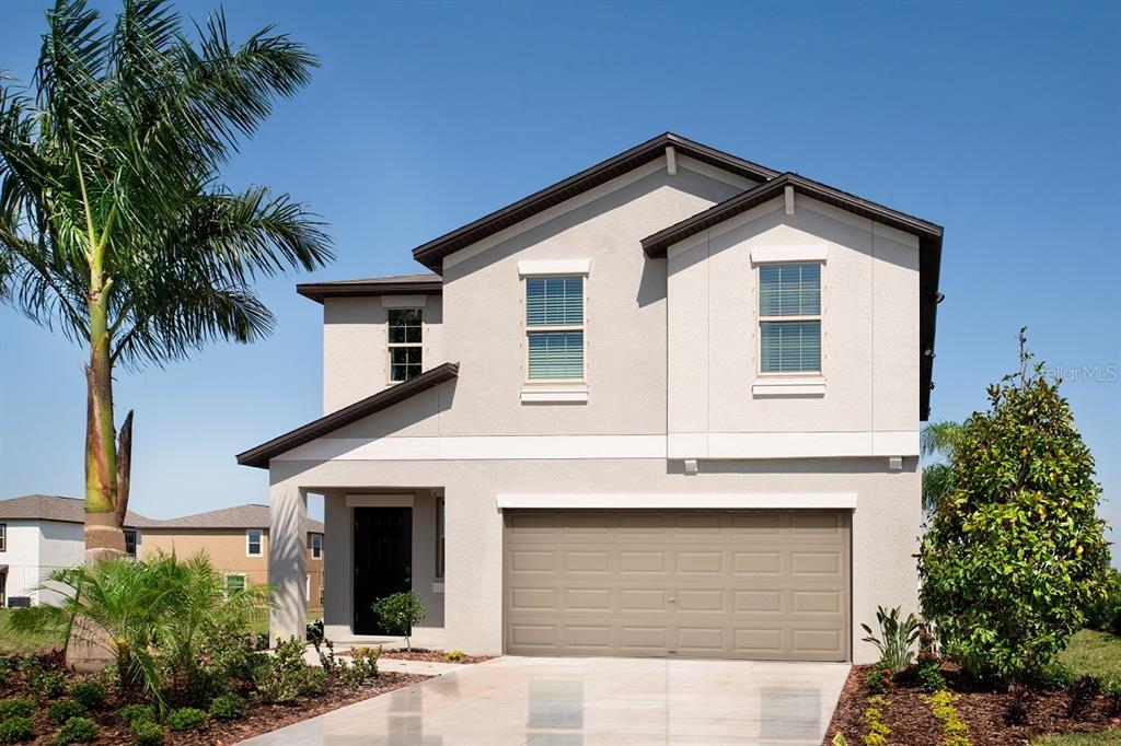 11582 Lavendar Loop Spring Hill Spring Hill, FL 34609 - Photo 1 of 1 a front view of a house with a yard