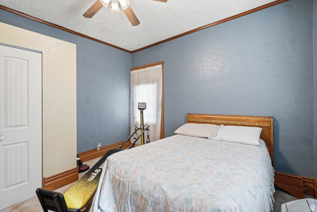5264 West 5500th Street South Hooper, UT 84315 - Photo 23 of 38 Bedroom featuring a ceiling fan, light blue walls, and warm wood trim