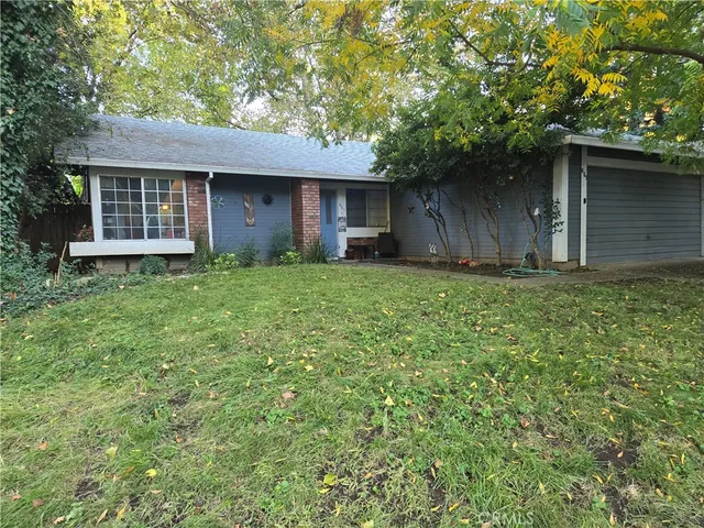 a house with a tree in front of it