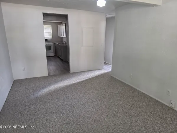 a view of a room with a hallway