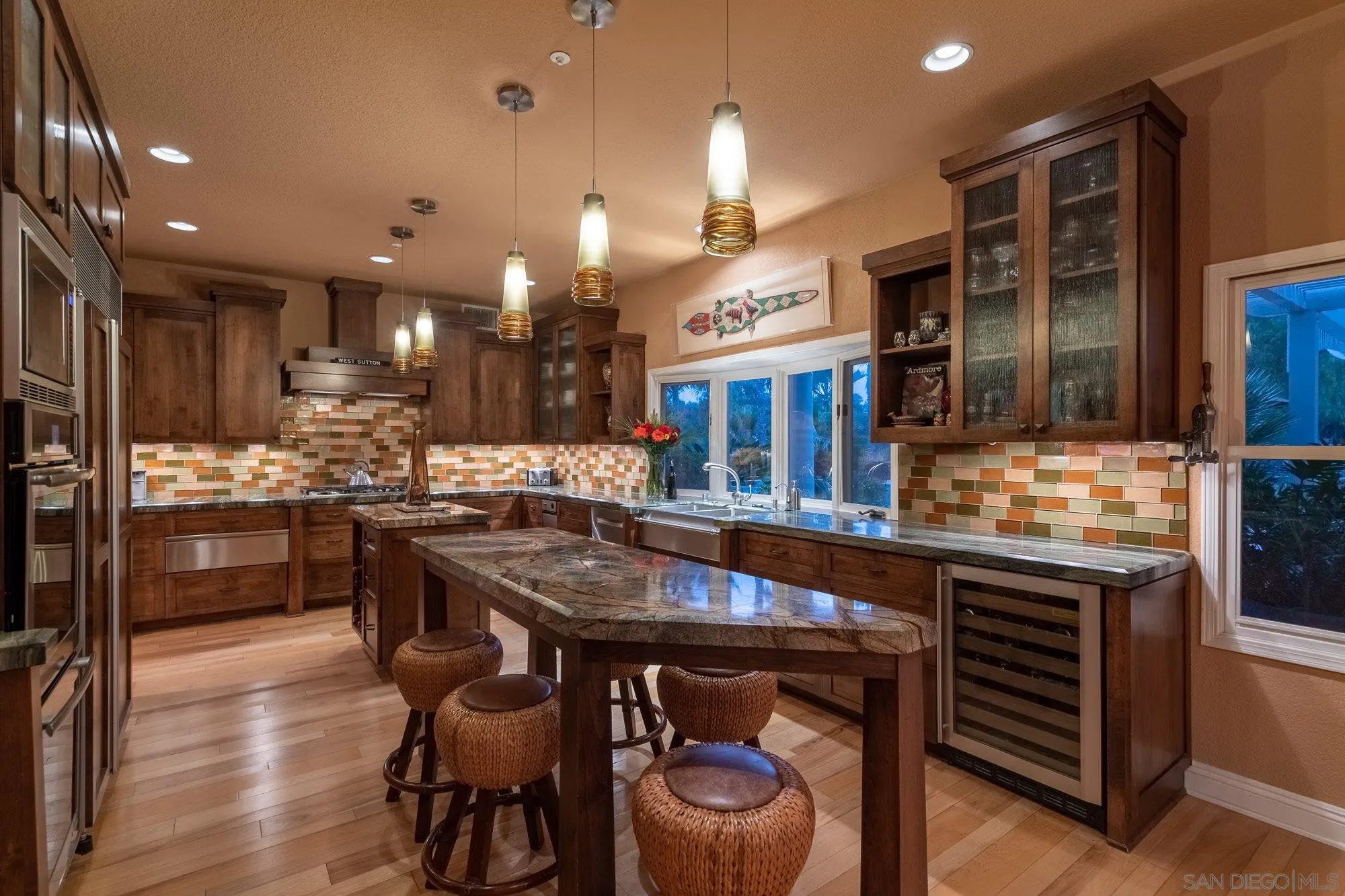 3397 Rocking Horse Circle Encinitas, CA 92024 - Photo 12 of 33 a kitchen with a table and chairs in it