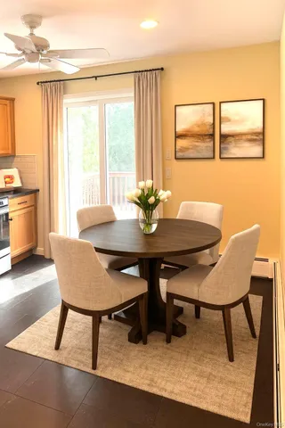 a view of a dining room with furniture and window