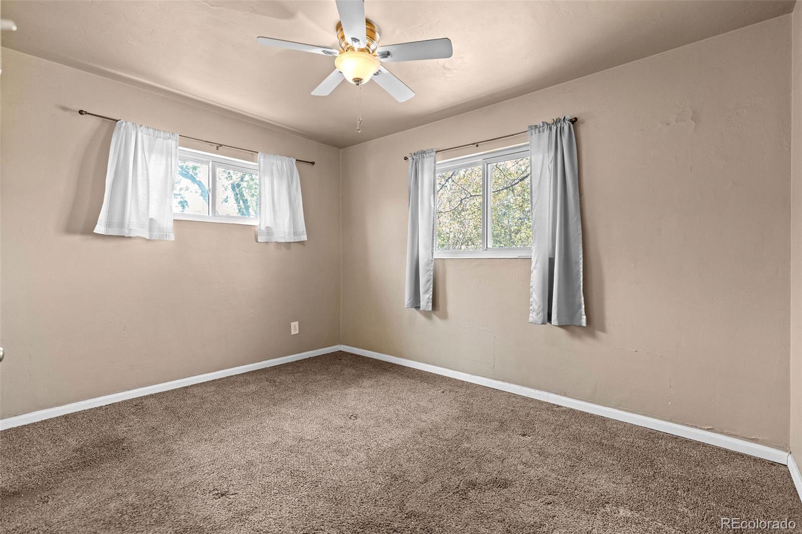 1283 Racine Street Aurora, CO 80011 - Photo 14 of 25 a view of an empty room with a window