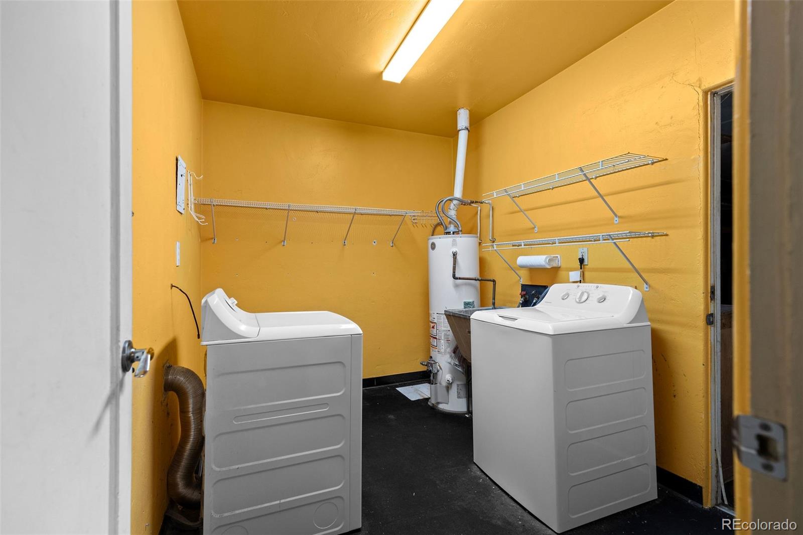 1283 Racine Street Aurora, CO 80011 - Photo 18 of 25 a utility room with dryer and washer